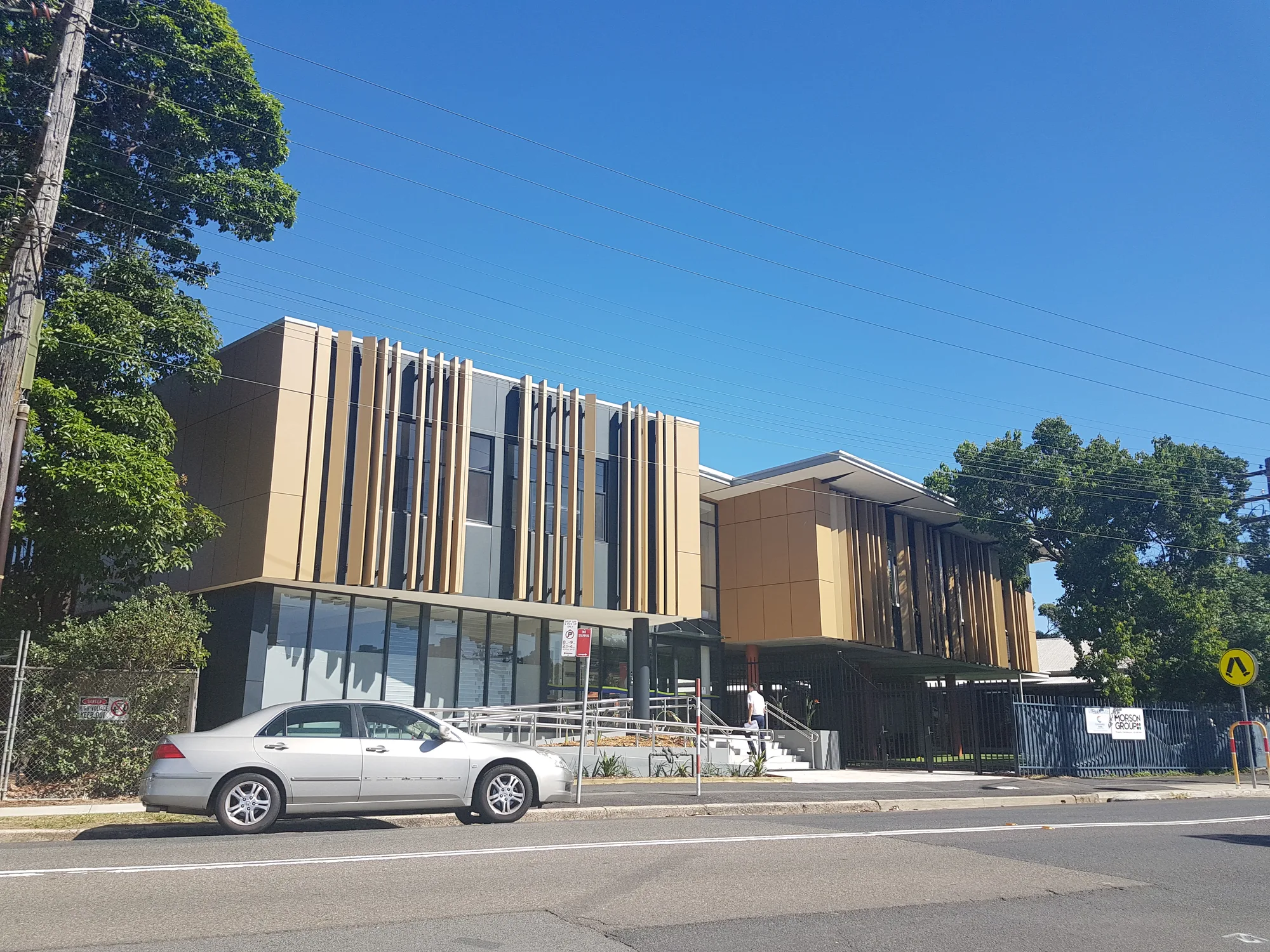 St Brendan’s street frontage, two storeys wrapped in bronze fins